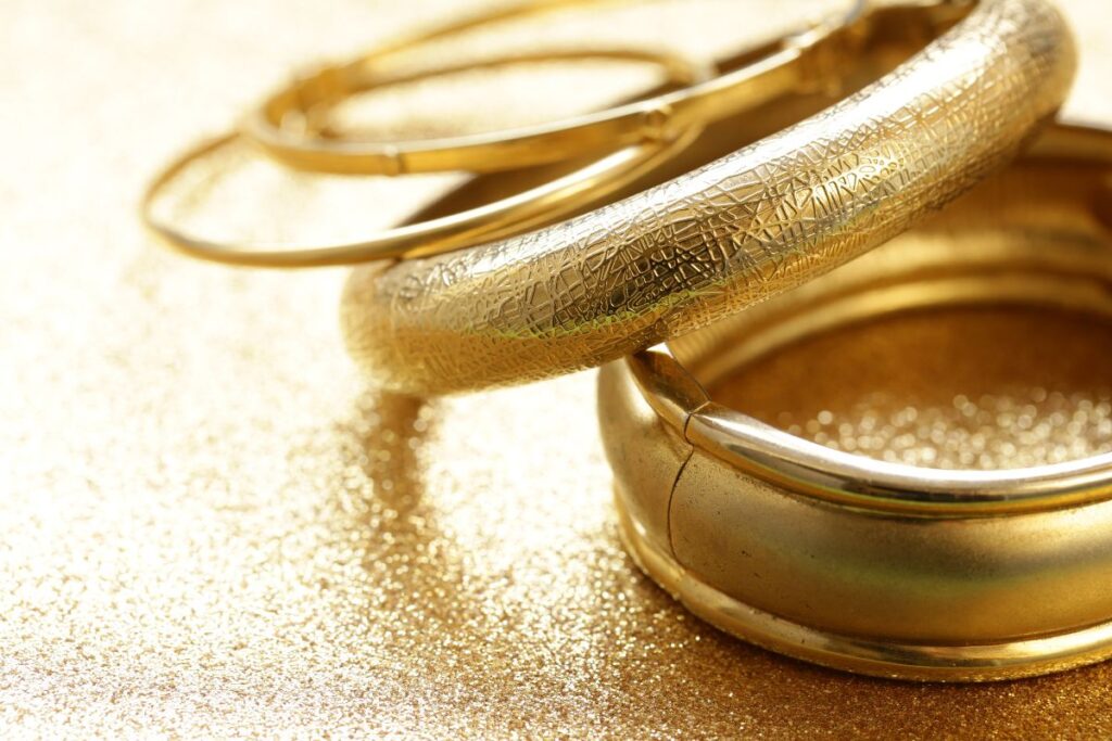 The bangle's jewelry is made from gold.