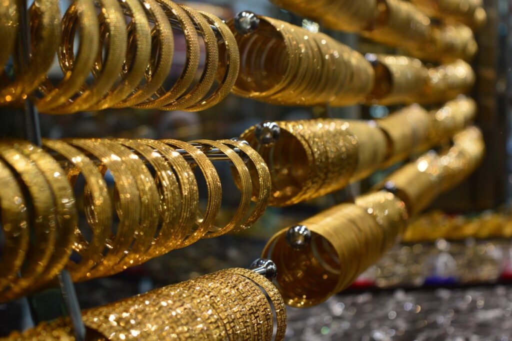 The bangles displayed in a jewelry store are real gold.