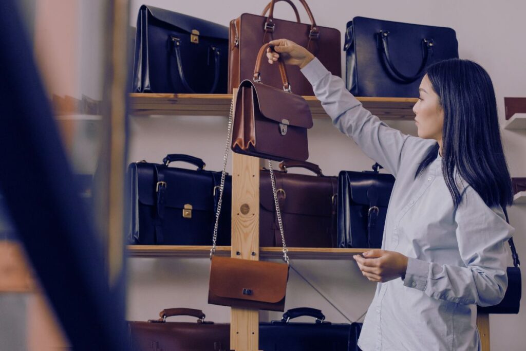 The woman checks the price of the Dior bag | Gold and Bags Pawn Shop